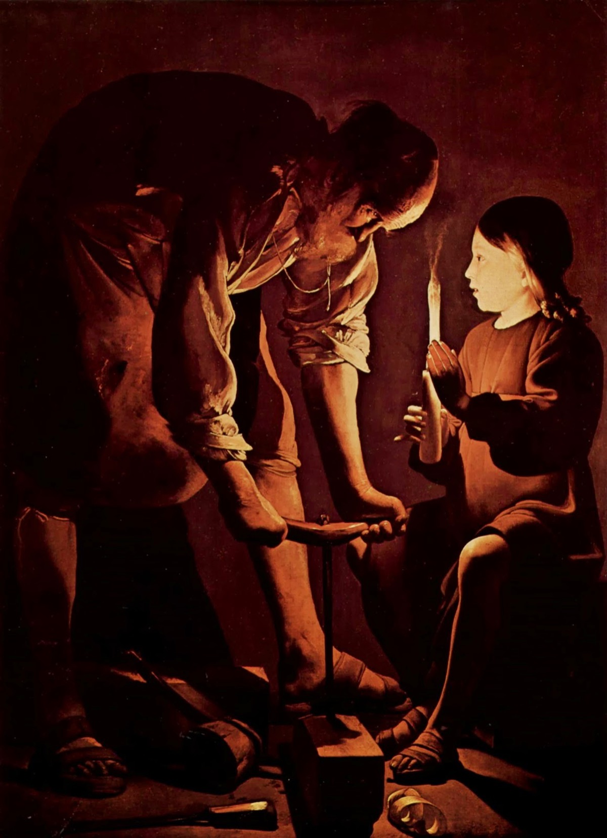 Saint Joseph the Carpenter by Georges de La Tour, 1645 - a single candle illuminates a craftsman's hands working in deep shadow, his young apprentice's face glowing softly in the candlelight